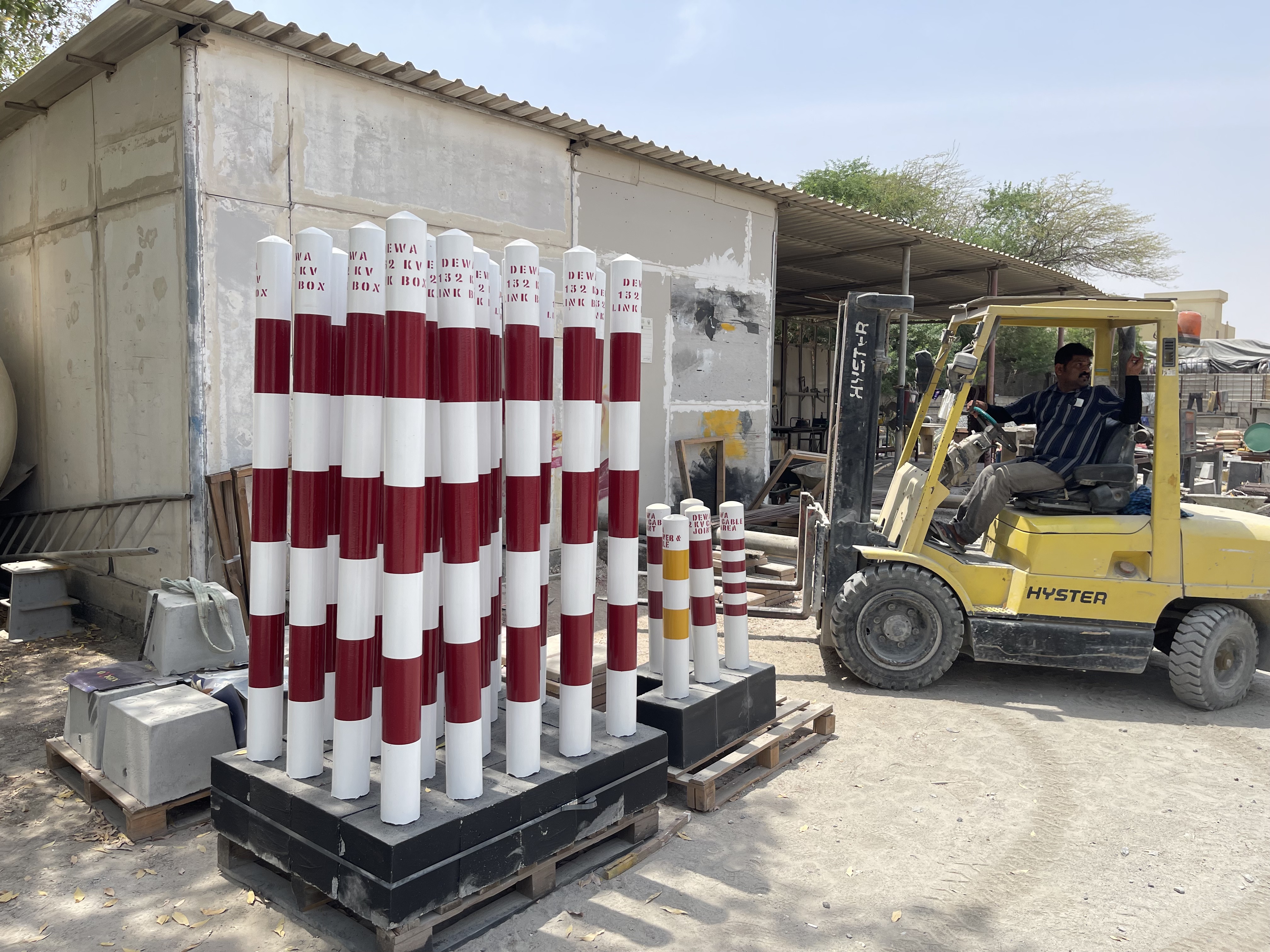 Bollards drying in rows in the yard
